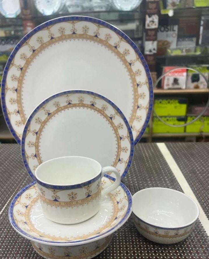 Blue and gold bordered bone china plate, cup, saucer and bowl set