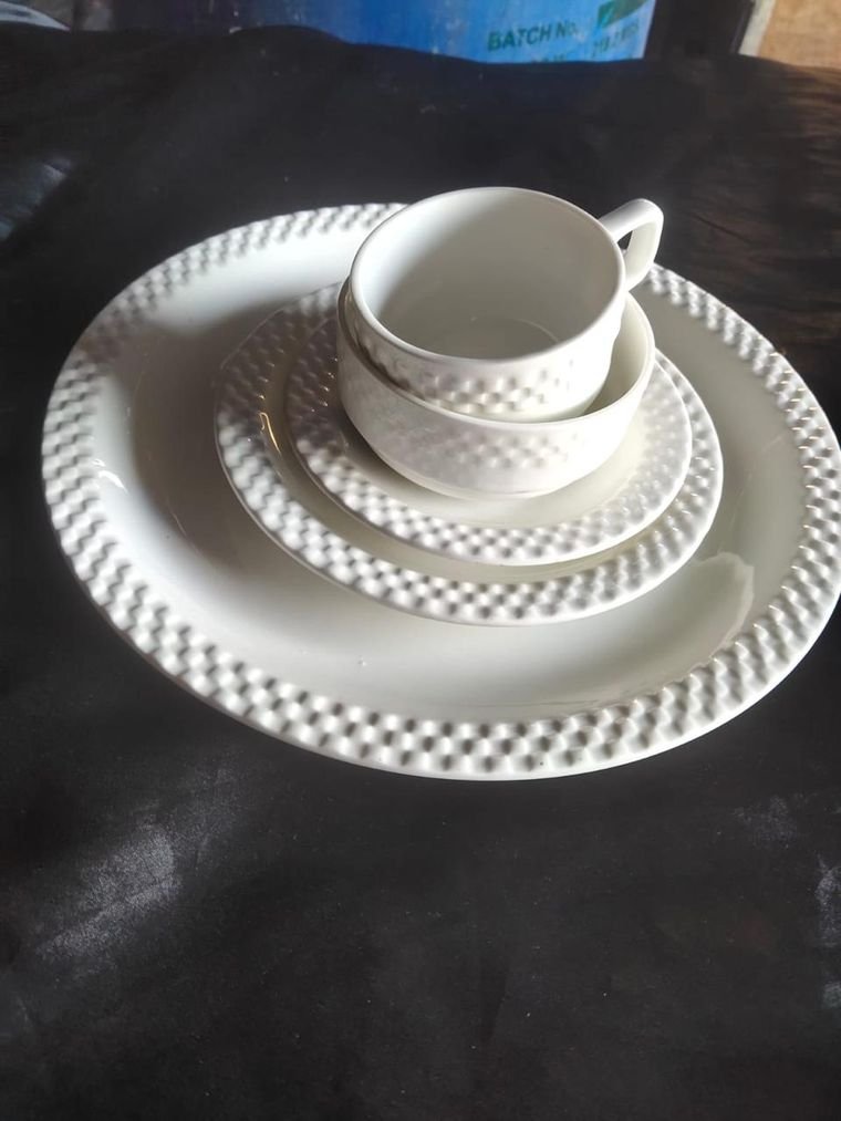 Plain white textured dinner plate, side plate, cup and bowl set